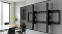 Soporte de Tv Ajustable 32 a 72" LEVO - a modern office meeting room wall with a lar